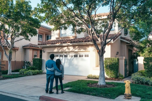 A man and a woman looking to buy a house.